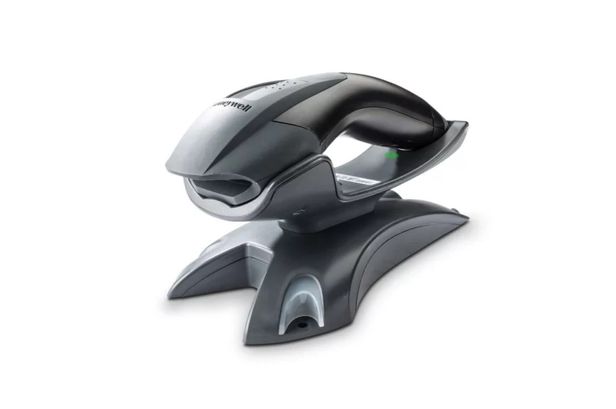 Honeywell Voyager 1202g scanner docked in its vertical charging and communication base - side view